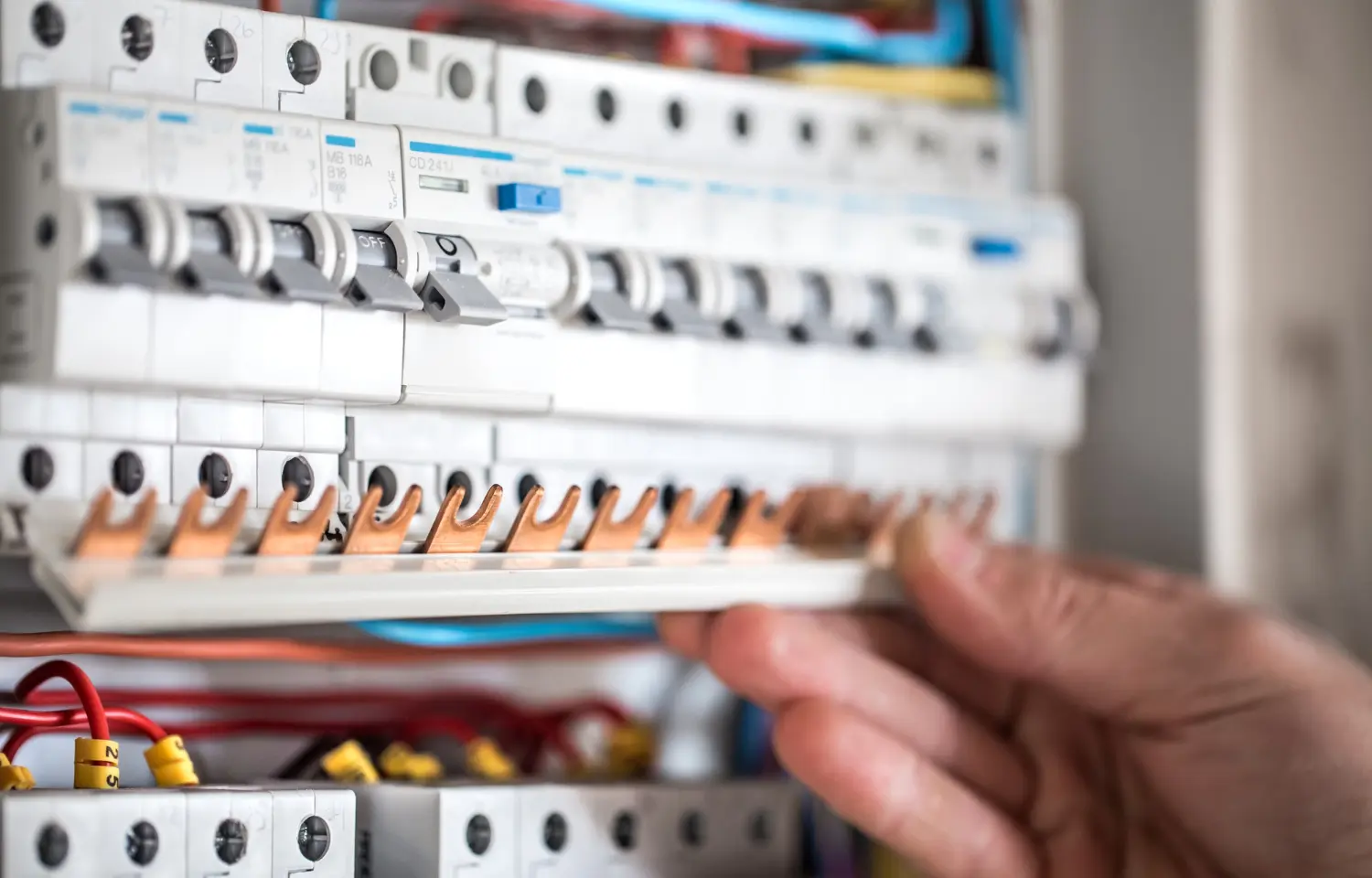 Electrician inspecting a home consumer unit