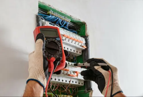 Electrician inspecting a consumer unit